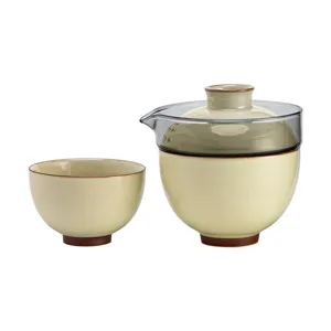 Elegant portable ceramic travel tea set with pot and matching cup in beige finish