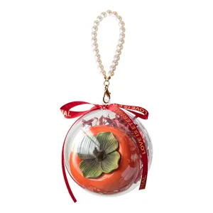 Elegant persimmon wedding candy box featuring a pearl handle and a red ribbon