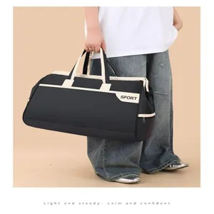 Large capacity black sports duffel bag with beige trim for travel, gym, and business trips.