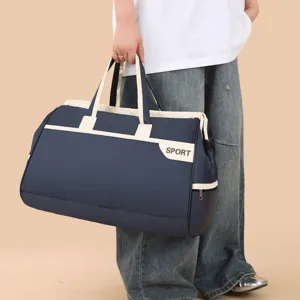 Large navy blue travel duffel bag with SPORT print for gym, sports, and weekend trips