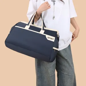 Navy blue large capacity travel duffle bag with beige handles and Sport logo