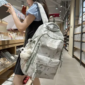 Fashionable Korean-style cream backpack featuring nature print and plush lamb charm detail