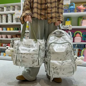 Detailed view of the landscape print backpack and tote bag set with cute plush charms