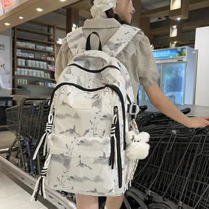 Back view of a white backpack with ink painting patterns on an Asian model