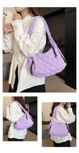 Stylish quilted purple puffer shoulder bag for women, soft cloud hobo tote for daily commute.