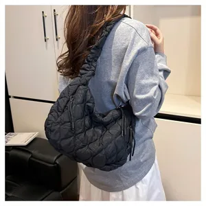 Black quilted cloud bag for women, stylish pleated shoulder tote and casual crossbody bag.
