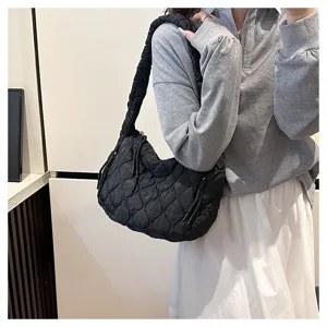 Black quilted cloud shoulder bag detail view, casual pleated crossbody tote for women daily commute.