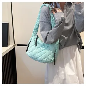 Light blue quilted cloud shoulder bag, casual puffer dumpling crossbody bag for daily use.