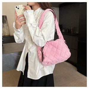 Pink quilted cloud shoulder bag for women, stylish wrinkled puffer crossbody tote handbag.