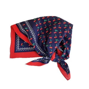 Navy blue cotton square scarf with red cherry prints and white polka dot border trim