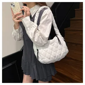 Close-up view of the quilted cloud shoulder bag showcasing soft pleated texture for daily commute.