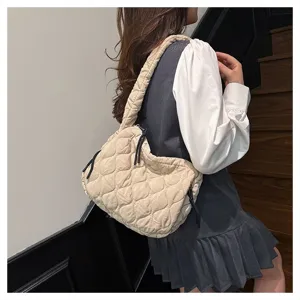 Detailed view of the quilted cloud shoulder bag, showing soft pleated texture and casual strap.