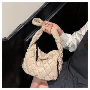 Chic quilted cloud shoulder bag for women, trendy pleated design with convenient zipper closure.