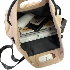 Large beige nylon messenger bag with open top showing spacious interior and daily essentials