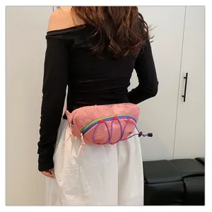 Rear view of model wearing a pink sequined sports waist bag with purple drawstrings