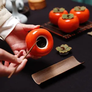 Petit boîte à thé en céramique en forme de kaki avec couvercle hermétique