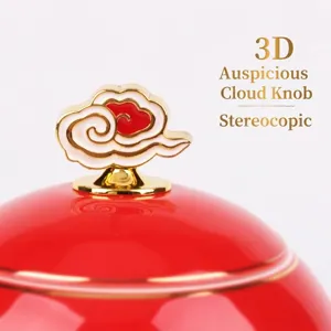 Eleganter roter Keramik-Teedosen-Deckel mit 3D-Glückswolkenknopf und Goldrandverzierung.