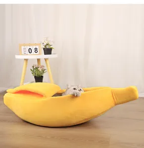 Detailed view of a semi-enclosed banana-shaped cat bed in a warm home environment