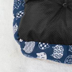 Cozy cartoon pet bed featuring anti-slip bottom and soft blue cat patterned fabric