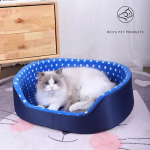 Soft navy blue polka dot pet bed for cats and dogs with semi-enclosed warm design.