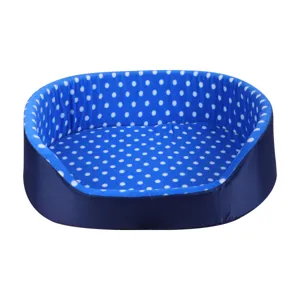 Soft blue plush pet bed with white polka dots for cats and small dogs in oval shape