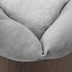 Cozy grey plush pet bed and car seat with soft raised edges for maximum comfort and safety.