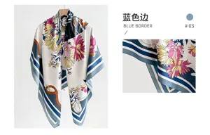 Close-up detail of a vintage floral silk square scarf featuring a chic blue border design
