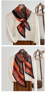 Retro geometric pattern silk-like scarf elegantly styled on a white shirt and pleated skirt
