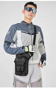 Detailed view of waterproof tactical drop leg bag worn by rider during outdoor activities