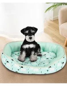 Comfortable mint green pet bed with polar bear pattern and a cute puppy sitting inside
