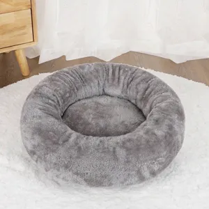 Cozy gray plush round donut pet bed for cats and small dogs providing winter warmth