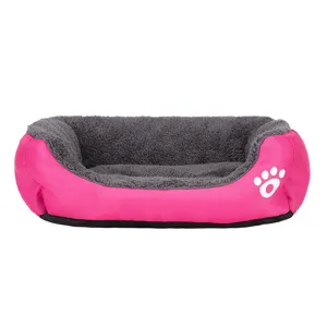 Comfortable pink and grey plush pet bed with white paw print design for dogs and cats