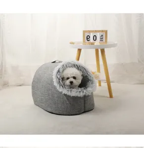 Small white dog resting in a cozy grey linen pet nest with soft plush lining detail