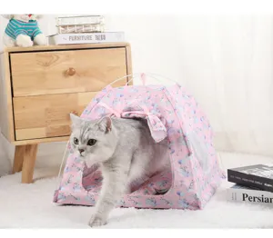 Pink folding pet tent house for cats and dogs with cute whale pattern and soft cushion inside.