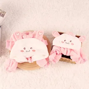 Two sets of cute pink bunny flannel hooded pet outfits for small dogs and cats on white rug