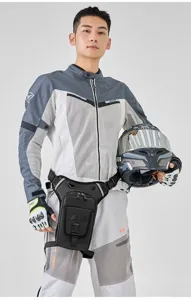 Male model wearing a black waterproof tactical motorcycle leg bag for outdoor riding
