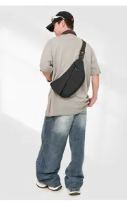 Stylish black multi-functional crossbody chest bag, modern lightweight travel sling bag.