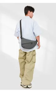Multifunctional sling chest bag detail shot, dark grey crossbody daypack, casual wear view.