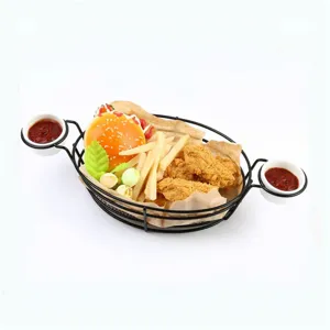 Detailed view of black iron wire snack basket with dual condiment holders for fries and burgers