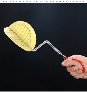 Close-up detail of a stainless steel taco press holding a corn tortilla for frying