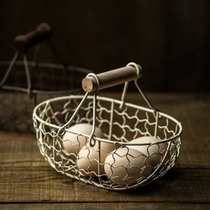Retro iron wire kitchen storage basket with wooden handle and rustic egg display