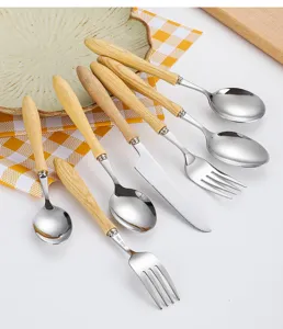 Close-up detail of 304 stainless steel cutlery with elegant ash wood handles