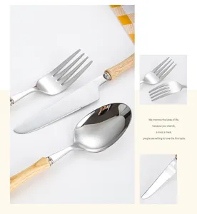 Close-up detail of 304 stainless steel cutlery set featuring natural ash wood handles