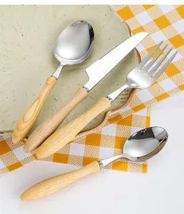 Detail view of 304 stainless steel cutlery set featuring elegant white ash wood handles