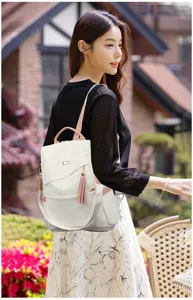 Back view of Asian model wearing a stylish white soft leather anti-theft backpack