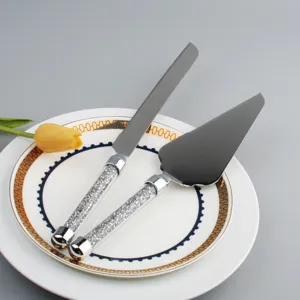 Elegante juego de cuchillo y pala para tarta de acero inox con mangos de cristal para bodas