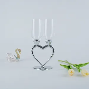 Detailed view of elegant heart-shaped crystal champagne glasses for wedding gifts