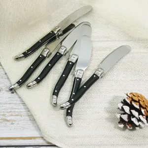 Set of five Laguiole style stainless steel butter knives featuring black handles and bee accent