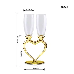 Dimensioned view of heart-shaped crystal champagne glasses set with 200ml capacity