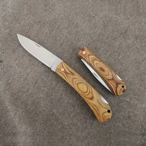 Detailed view of the classic folding pocket knife featuring a unique colorful wood grain handle